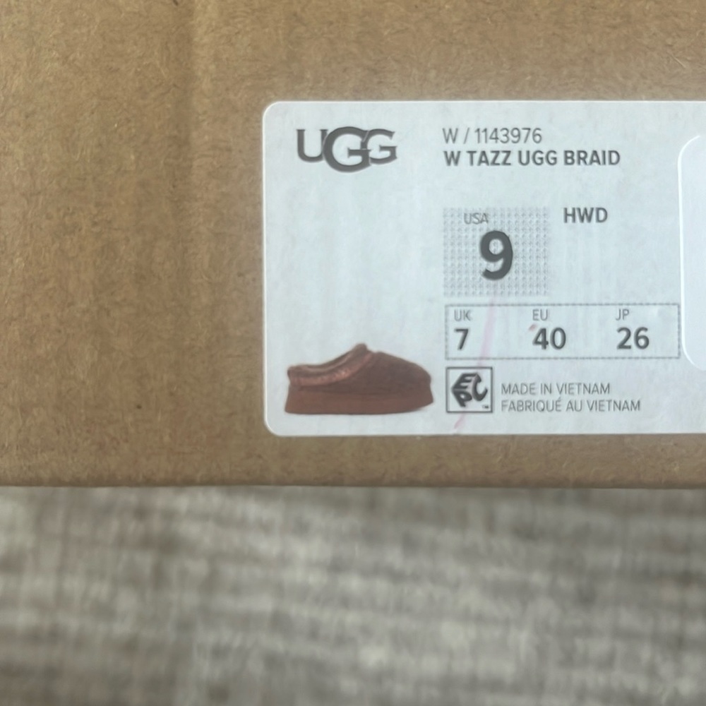 Brand new, in box UGG Tazz braid slip-ons in the color Hardwood. Size 9.